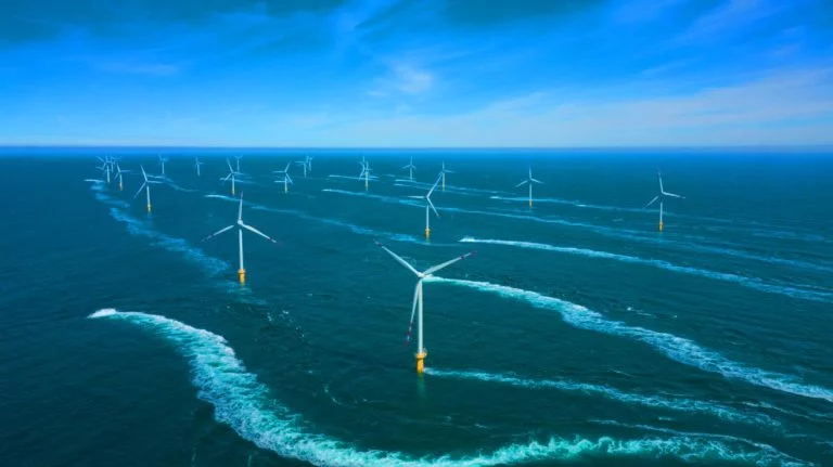 Illustration of the wake effect impacting offshore wind turbines, generated by artificial intelligence.