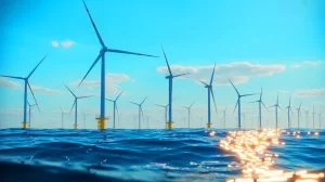 Illustration of recyclable turbine blades being installed at the Sofia Offshore Wind Farm.