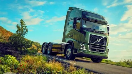 Illustration of Volvo's pioneering stop/start engine feature in heavy-duty trucks enhancing fuel efficiency and reducing emissions.