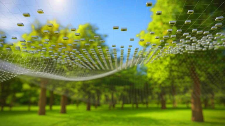 Illustration of smart dust technology with tiny sensors collecting data in the environment.