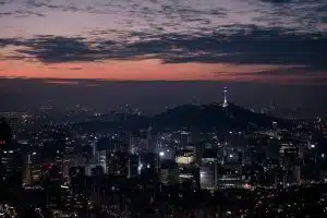 Korean Companies Are Losing Ground to China: Why Governance Failures at Conglomerates Like Young Poong Group Matter More Than Ever lighted city skyline at night